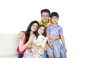 Indian Parents Children Sitting Sofa