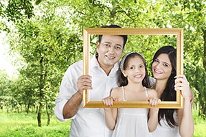 Parents Daughter Holding Frame Picture Park