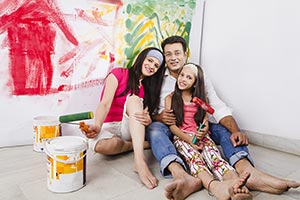 Parents Daughter Hoilding Paint Roller Home Improv