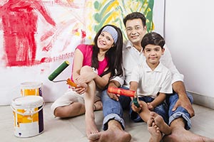 Indian Family Hoilding Paint Roller Home Improveme