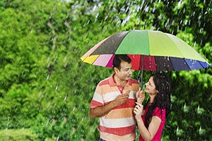 Indian Couple Eating Ice cream Rain