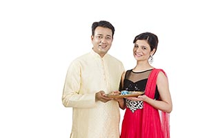 Couple Holding Plate Oil Lamps Diwali