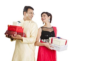 Couple Holding Gift Boxes Diwali Celebration