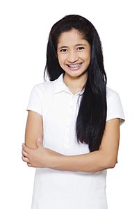 Teenage Girl Wearing Braces Smiling Cheerfully