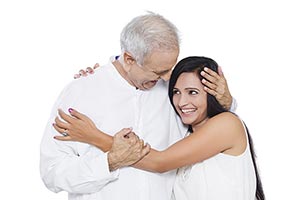 Senior Father Hugging Adult Daughter