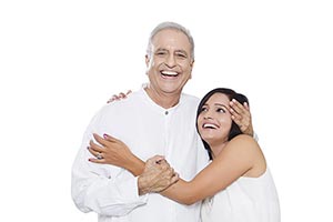 Old Father Hugging Adult Daughter