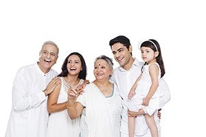 Indian Joint Family Standing Together Pointing