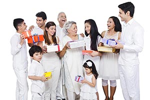 Indian Joint family Holding Gift Boxes