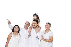 Happy Indian Family Looking Pointing