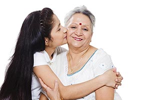 Granddaughter kissing Grandmother White Background