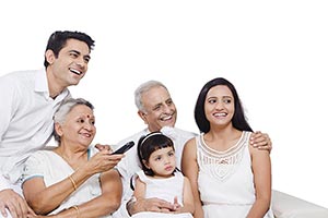 Indian Family Sitting Sofa Watching