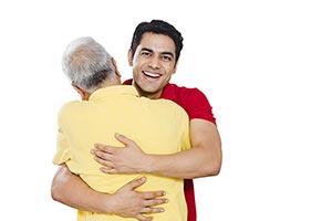 Adult Son Hugging Old Father