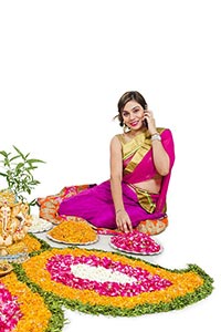 Woman Making Flower Rangoli Talking Cellphone