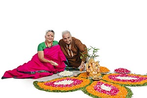 Senior Couple  Decorating Rangoli Diwali