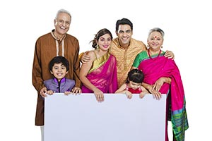 Traditional Indian Family Holding Message Board