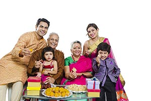 Indian Family Diwali Giving Sweets