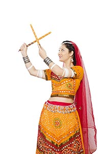 Woman Chaniya Choli Performing Dandiya Raas