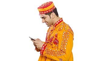 Traditional Gujrati Man Reading Message Phone