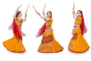 Gujrati Woman Performing Dandiya Dance Multiple Pe