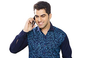 Indian Man Talking Mobile phone Smiling