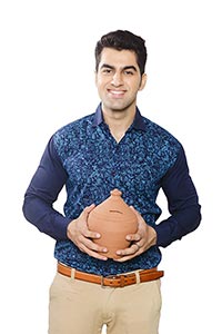 Smiling Indian Man Saving Money Piggybank