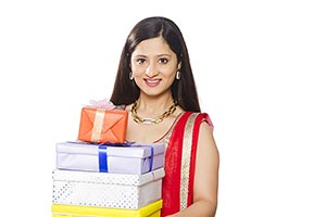 Smiling Indian Woman Traditional Holding Gifts