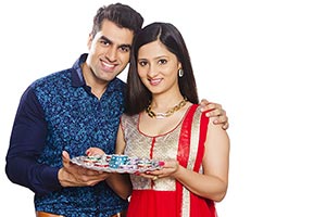Indian Couple Diwali Festival Holding Lamps
