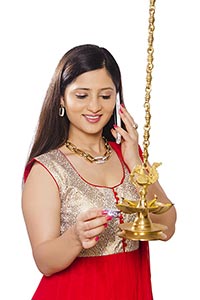 Woman Burning Oil lamps Diwali Talking Phone