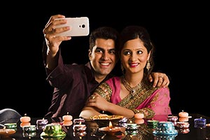 Couple Taking Selfie Lighting Diyas Diwali Celebra