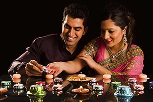 Diwali Festival Married Couple Lighting Diyas