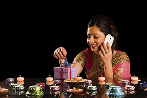 Woman Opening Gift Box Talking Phone Diwali