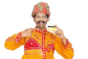 Gujrati Man Showing Credit Card Pointing