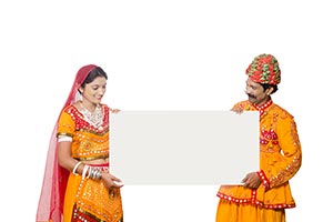 Gujrati Couple Holding Whiteboard Watching