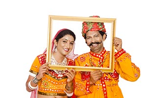 Gujrati Couple Holding Picture Frame