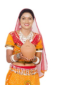 Rajasthani Woman Holding Piggybank