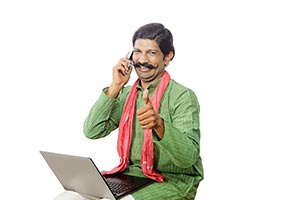 Rural Man Laptop Talking Phone