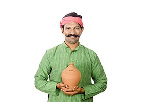 Rural Man Holding Piggy Bank