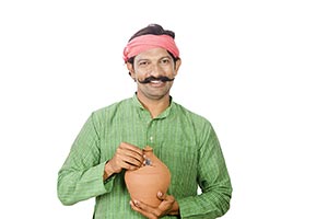 Rural Man Inserting Coin Piggybank