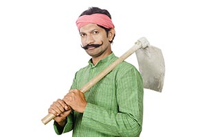 Indian Rural Farmer Carrying Spade