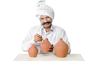 Farmer Man Inserting Coin Piggybank