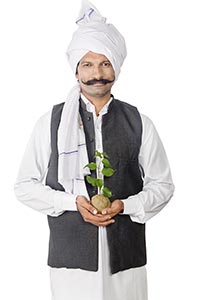 Indian Farmer Holding Plant