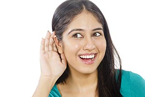 Young Girl Cupping hand Eavesdropping