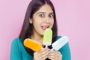 Young Woman Showing Ice cream