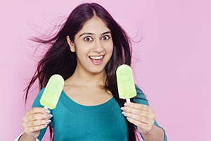 Teenage Girl Giving Ice cream