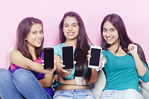 Teenage Girls Showing Phone