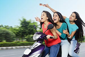 Teenage Girls Riding Scooty Speed