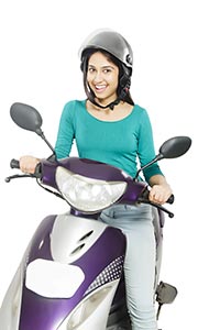 Young Girl Riding Scooty