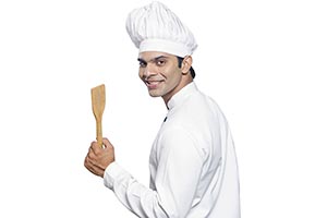 Indian Man Chef Showing Spatula Smiling
