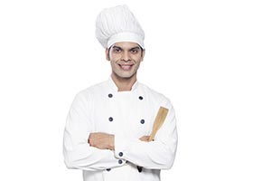 Portrait Male Chef Holding Spatula Smiling