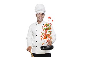Indian Chef Flipping Vegetables Frying Pan